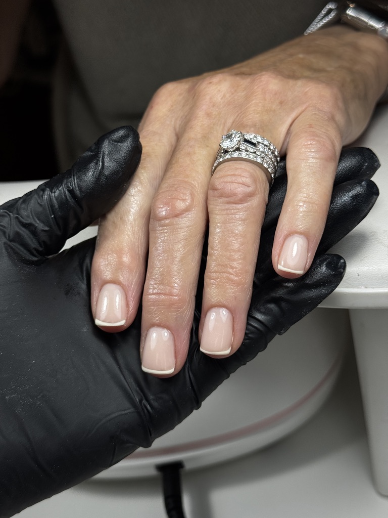 French manicure being applied in studio